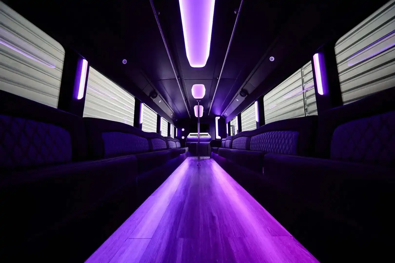 25 Passenger Bus inside with bight purple neon lights