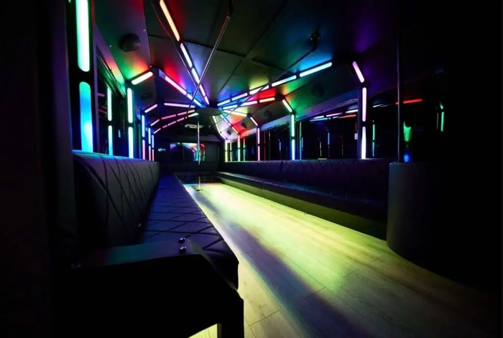 Inside of a Pregame Party Bus with neon lights.